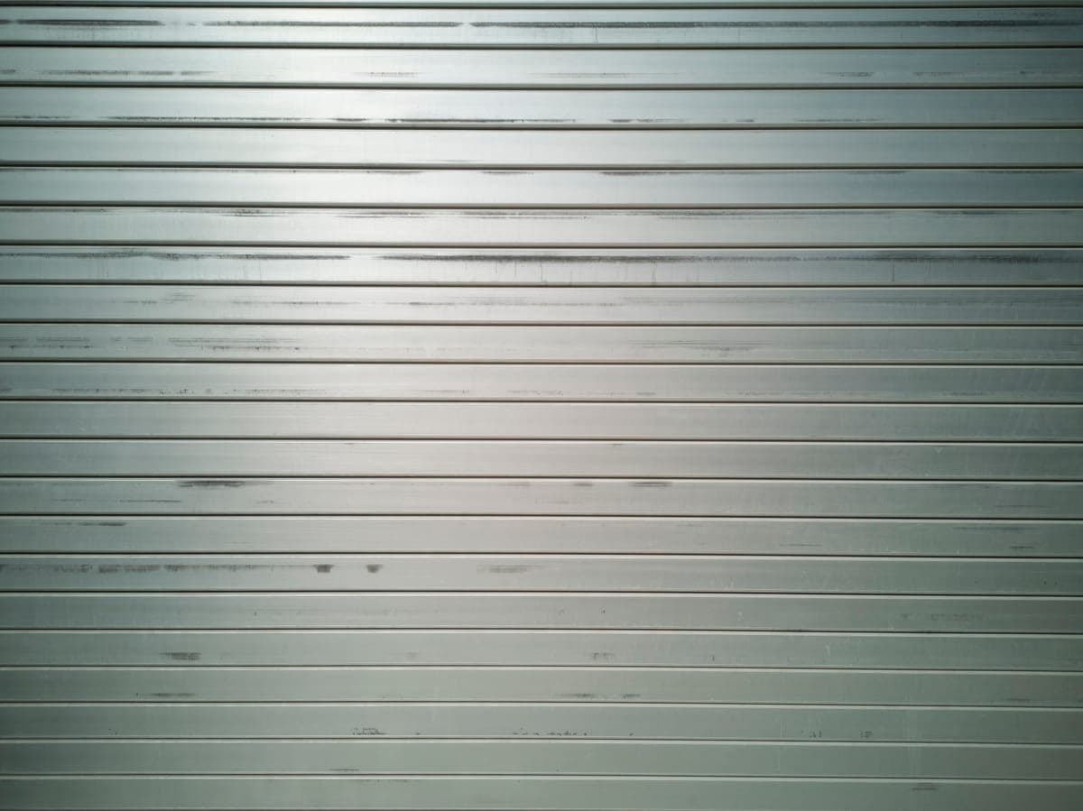 Close detail of an extruded aluminum profile edge and powder-coated surface